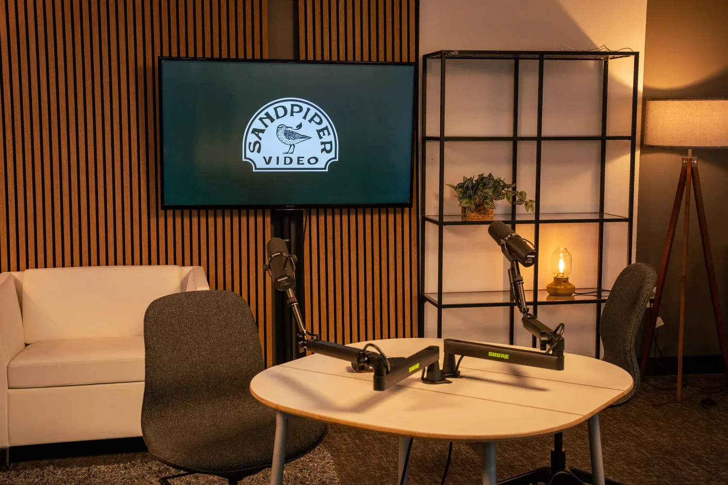 Seattle podcast recording studio with cameras, lights, and podcast microphones